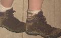 Muddy shoes from hiking in the rain