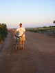 William walking his bike around the airport runway